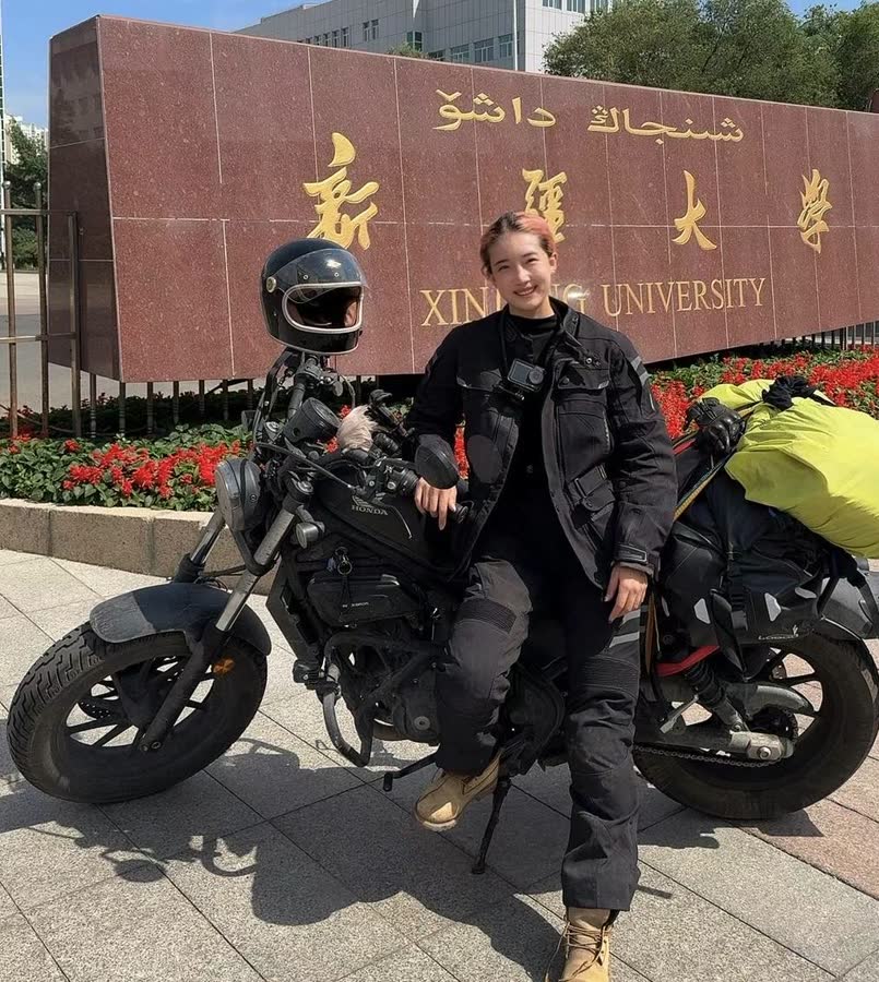 Yiyi on a motorcycle trip at Xinjiang University